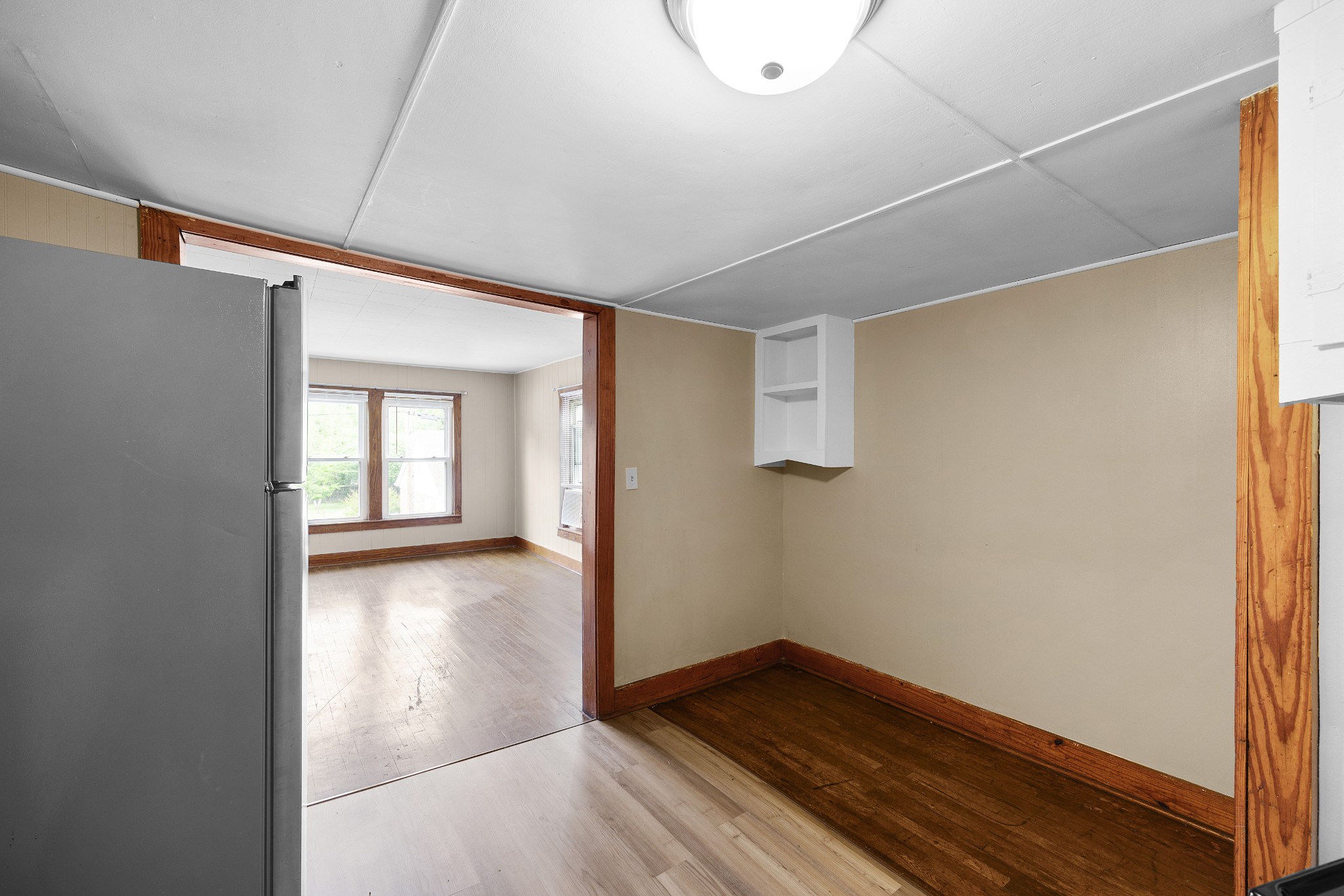 116 Summer Street Martin, TN 38237 - Photo 8 of 43 a view of an empty room with wooden floor and a window