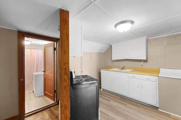 a kitchen with a refrigerator and a sink