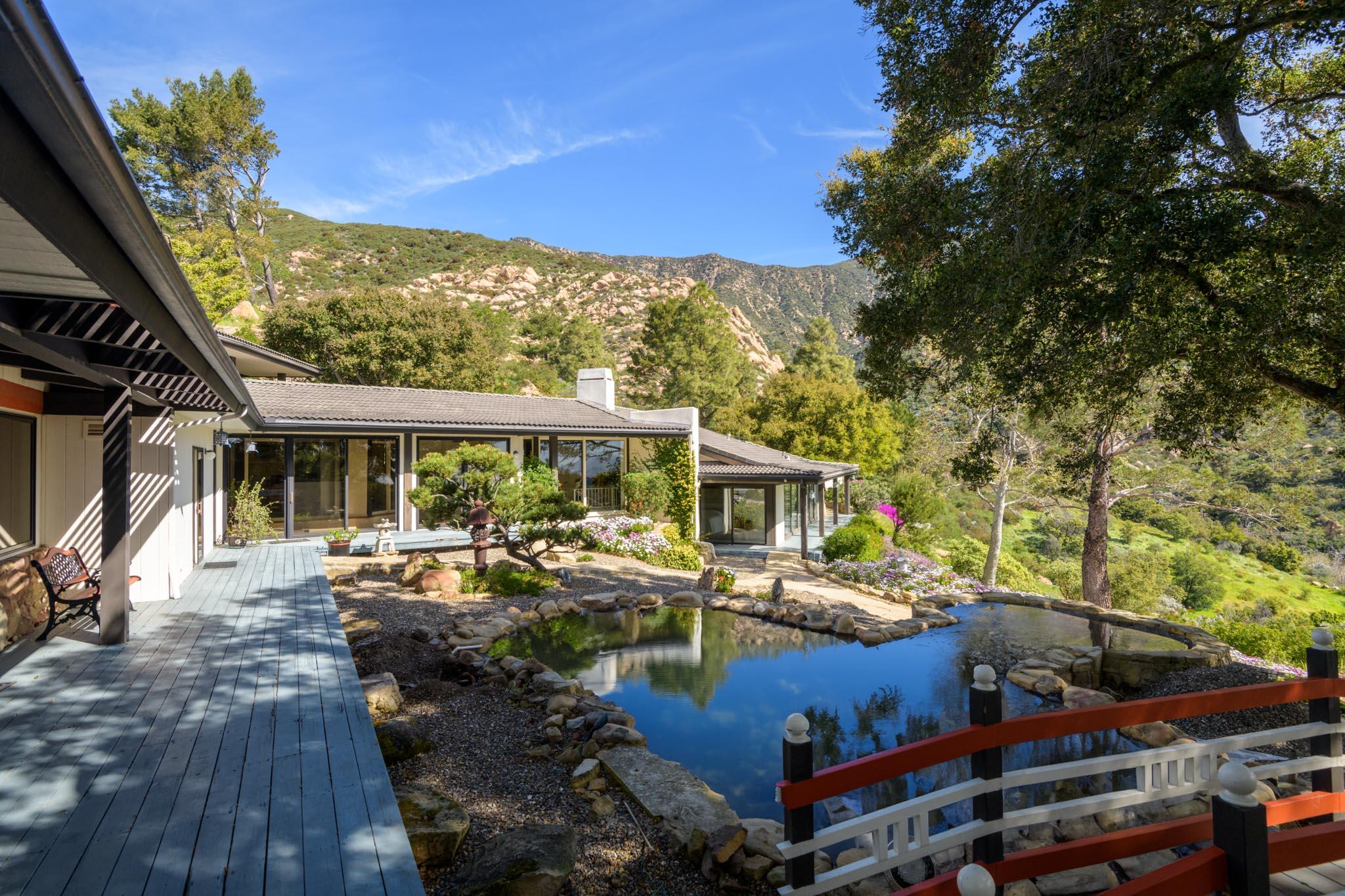 909 Park Lane Montecito, CA 93108 - Photo 15 of 39 a view of a patio with table and chairs and potted plants