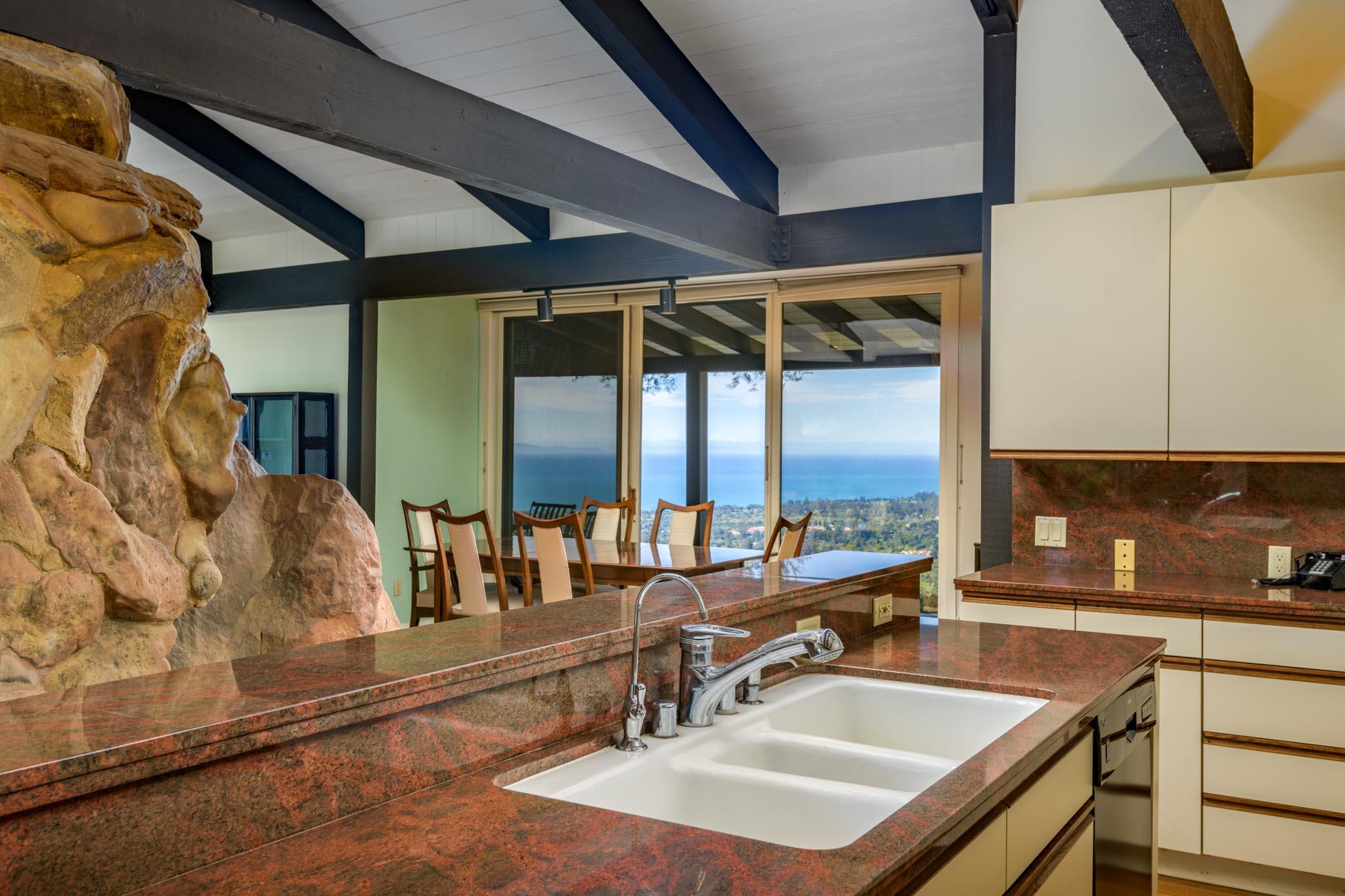 909 Park Lane Montecito, CA 93108 - Photo 21 of 39 a bathroom with a sink and a large mirror