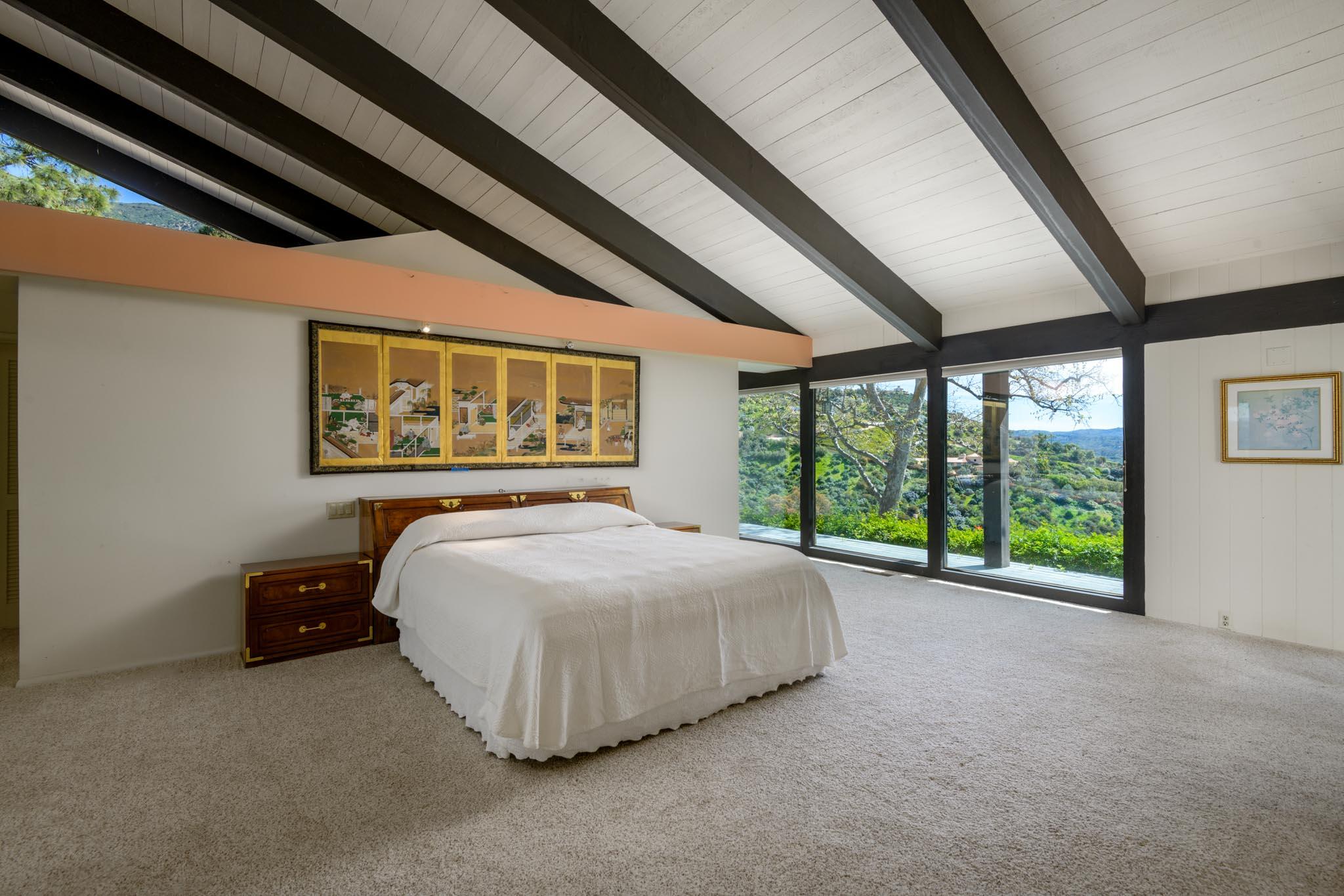 909 Park Lane Montecito, CA 93108 - Photo 31 of 39 a bed sitting in a room next to a large window