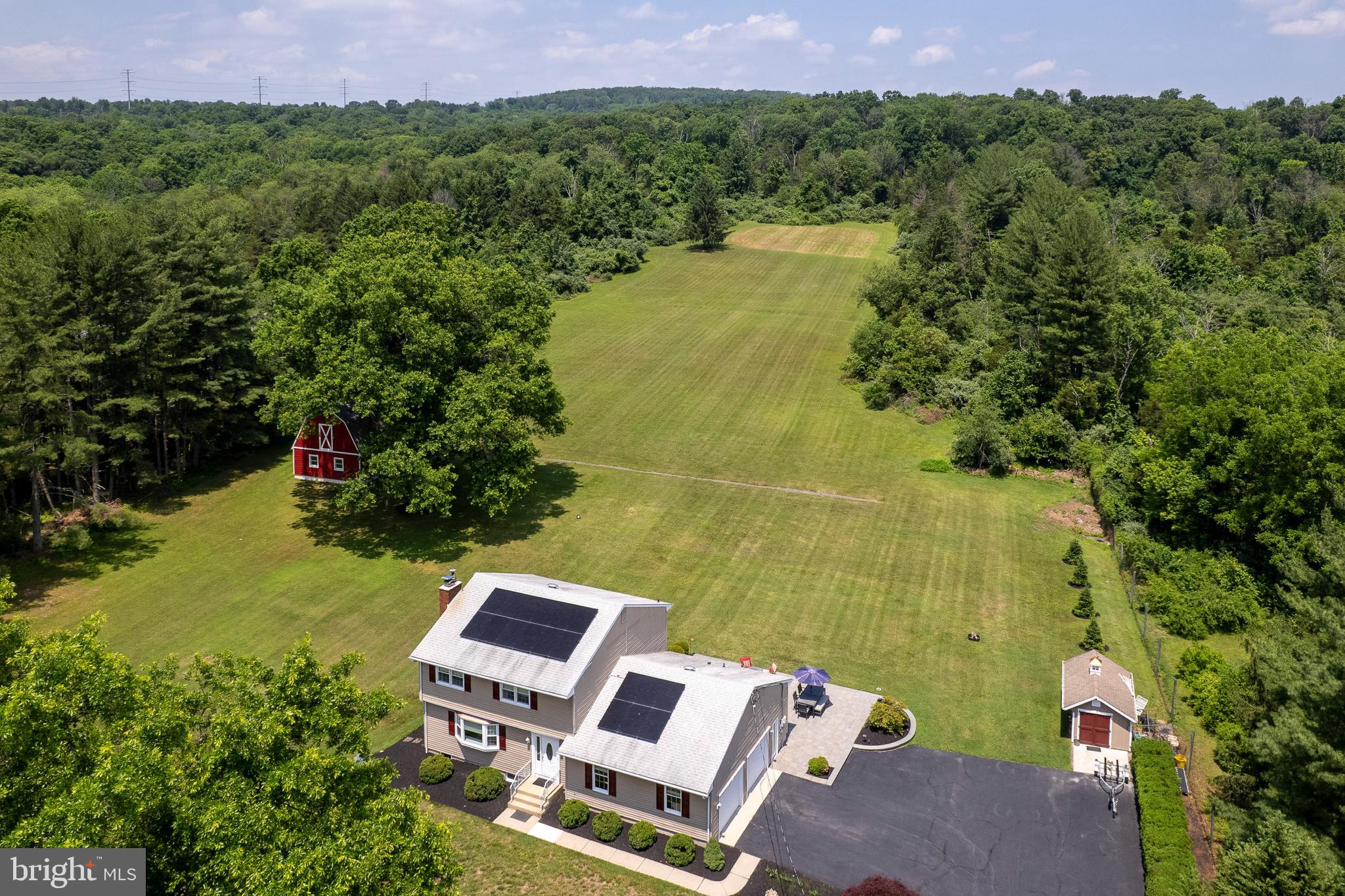 56 Valley Road Lambertville, NJ 08530 - Photo 4 of 49 an aerial view of a house with garden space and a lake view