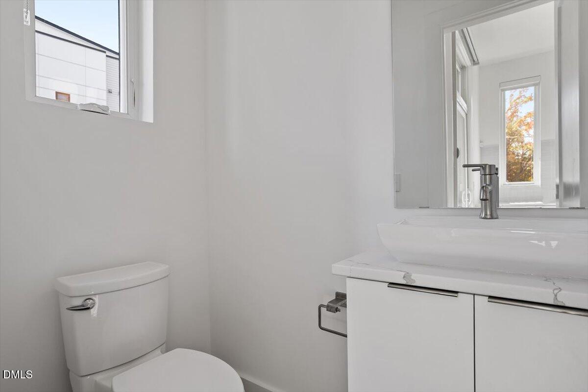 603 North Queen Street Durham, NC 27701 - Photo 13 of 40 a bathroom with a sink and a toilet