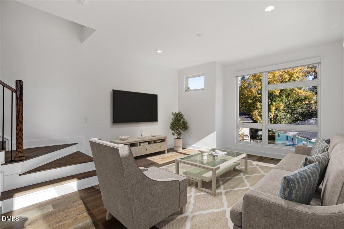 603 North Queen Street Durham, NC 27701 - Photo 20 of 40 a dining room with furniture and a flat screen tv