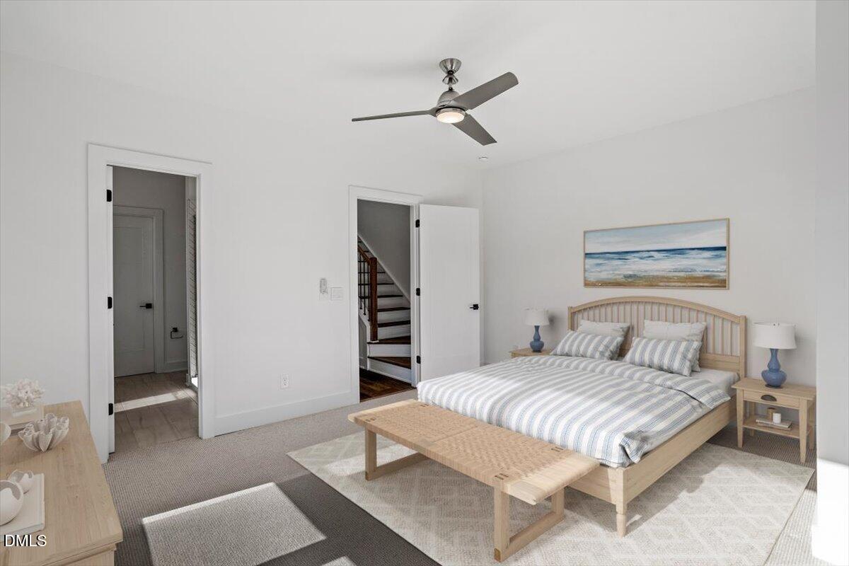 603 North Queen Street Durham, NC 27701 - Photo 28 of 40 a bedroom with a bed and a table