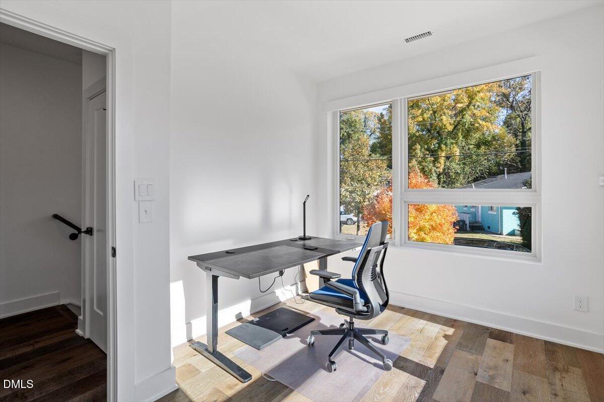 603 North Queen Street Durham, NC 27701 - Photo 5 of 40 a view of a workspace with furniture and a window