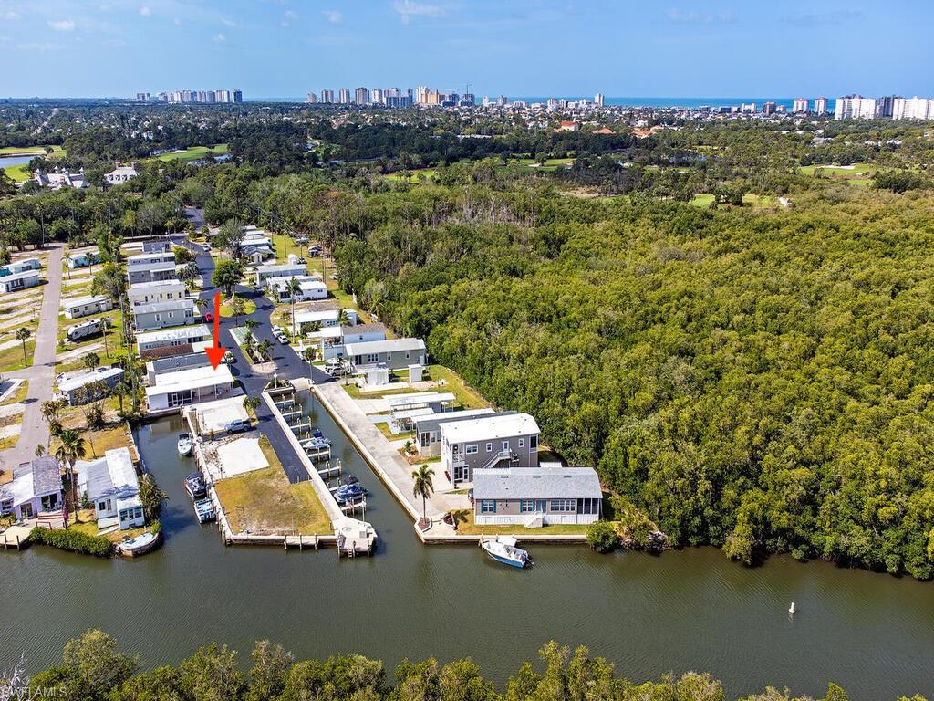 777 Walkerbilt Road, Unit 17 Naples, FL 34110 - Photo 15 of 19 an aerial view of residential houses with outdoor space