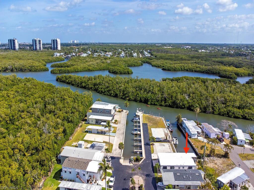 777 Walkerbilt Road, Unit 17 Naples, FL 34110 - Photo 17 of 19 a view of a city with an ocean view
