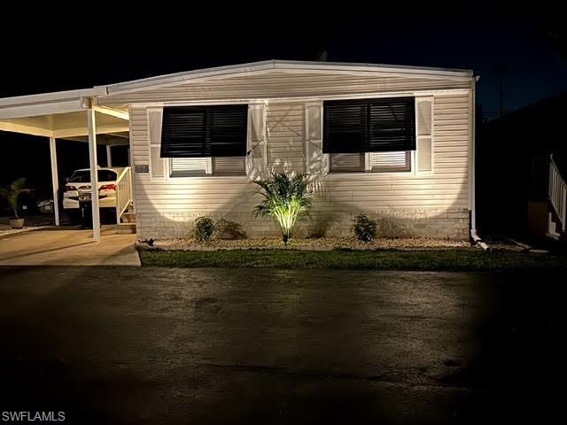 777 Walkerbilt Road, Unit 17 Naples, FL 34110 - Photo 19 of 19 a front view of a house with swimming pool