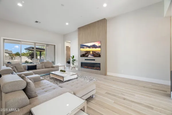 a bed sitting in a room next to a window