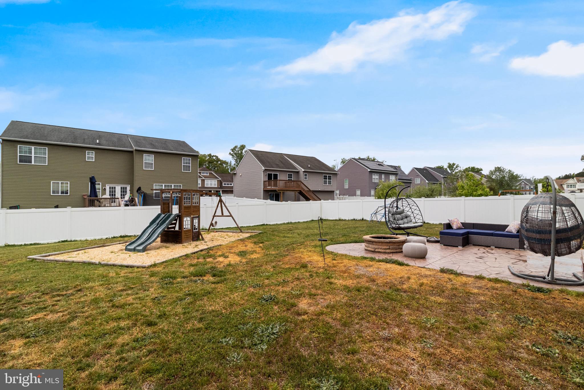 45546 Bethson Street California, MD 20619 - Photo 35 of 36 Fenced backyard with hardscape and firepit