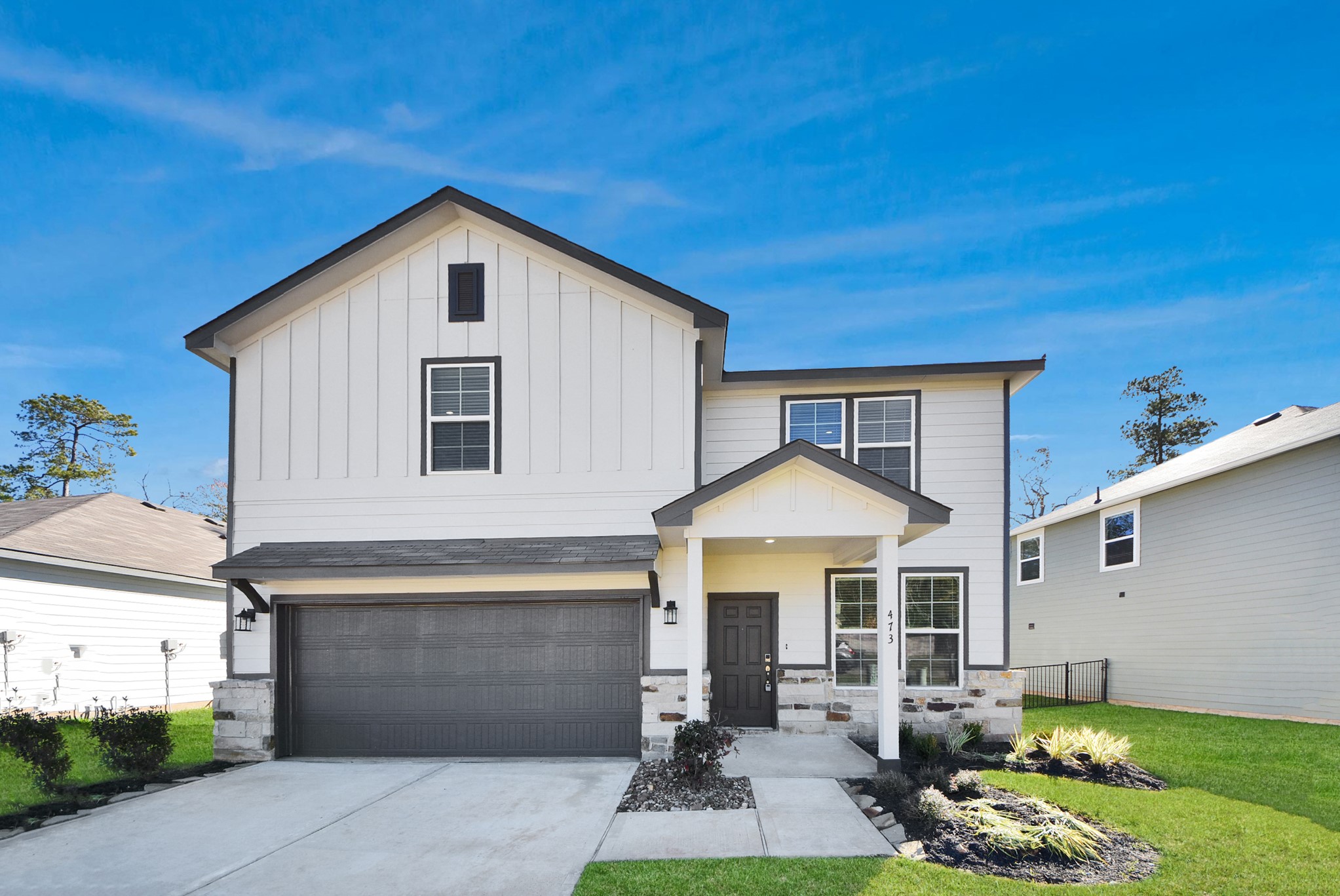 a front view of a house with garden