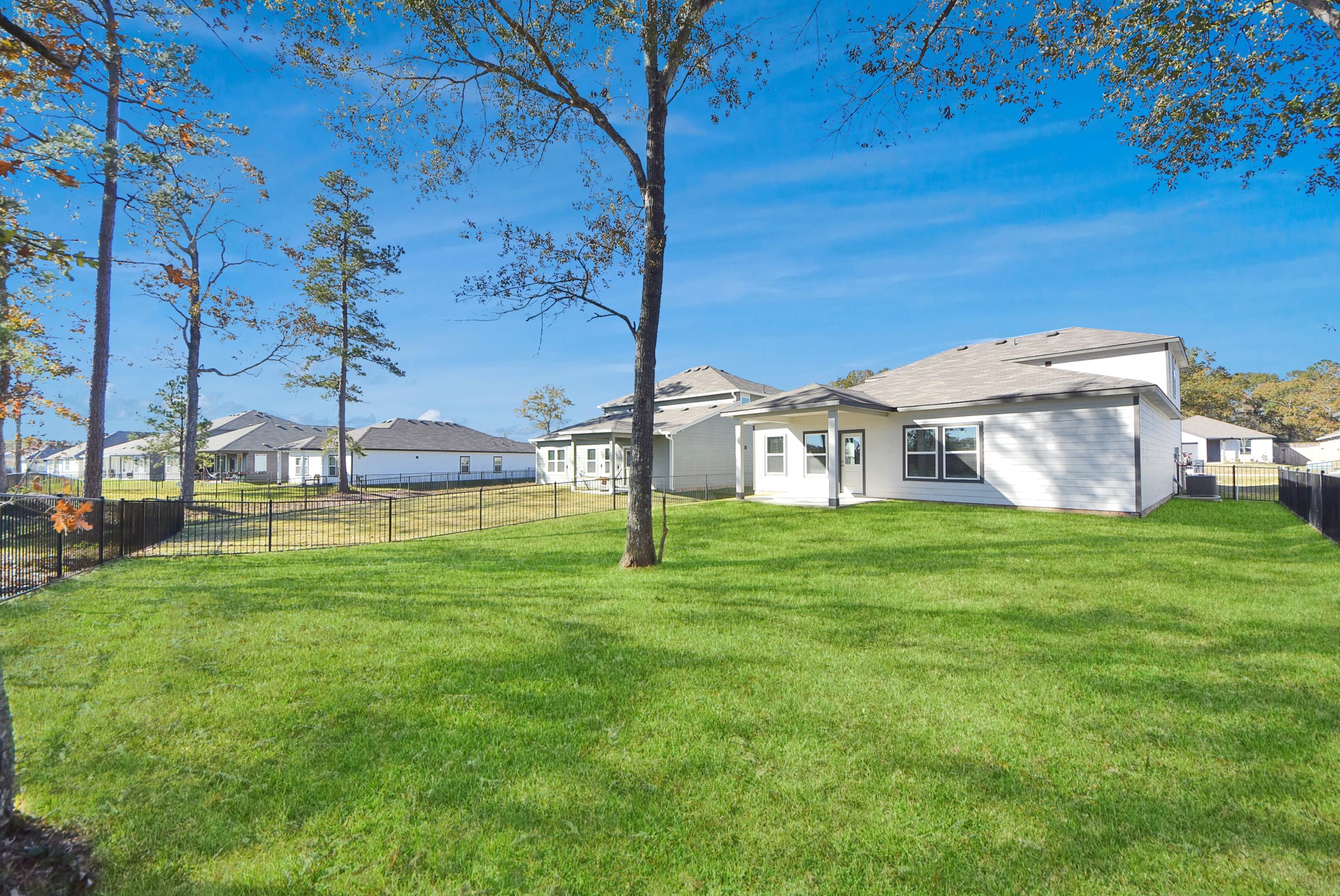 473 Shoreview Drive Conroe, TX 77303 - Photo 12 of 49 a view of a house with a backyard