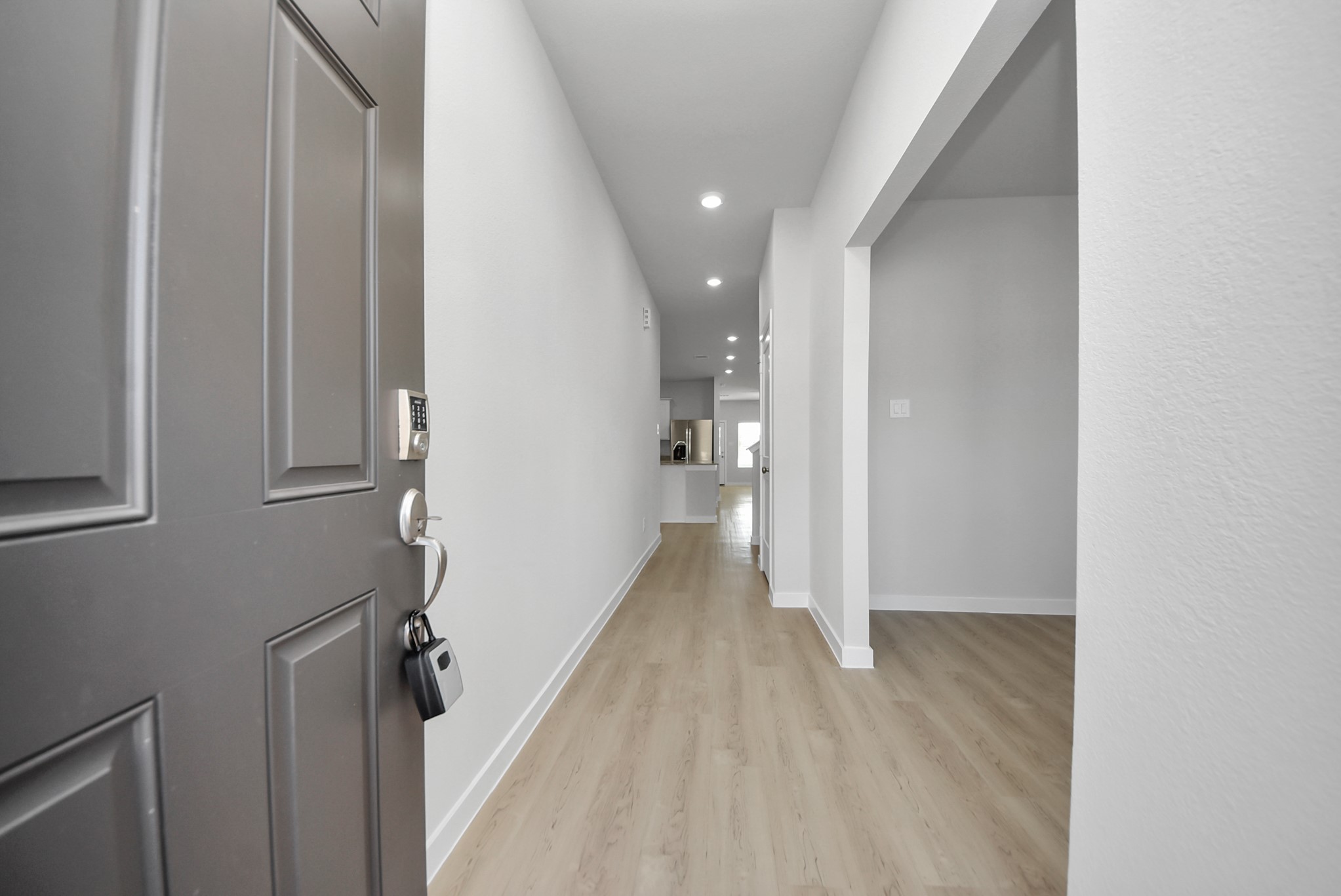 473 Shoreview Drive Conroe, TX 77303 - Photo 14 of 49 a view of a hallway with wooden floor and staircase