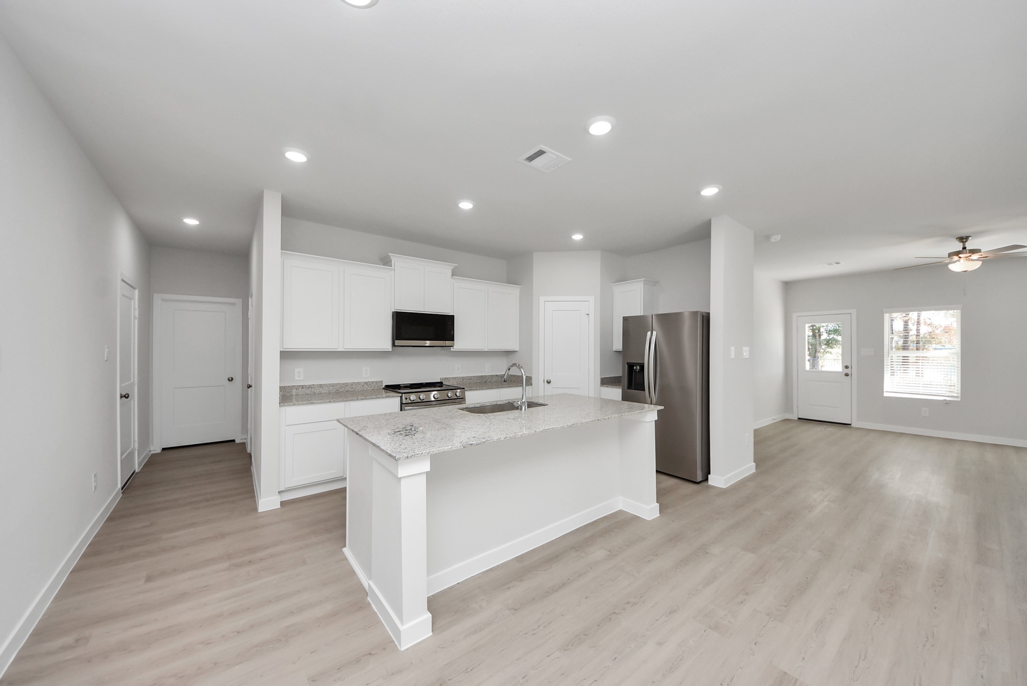 473 Shoreview Drive Conroe, TX 77303 - Photo 21 of 49 a view of kitchen with stainless steel appliances refrigerator stove microwave and cabinets