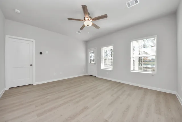 a view of an empty room with a window
