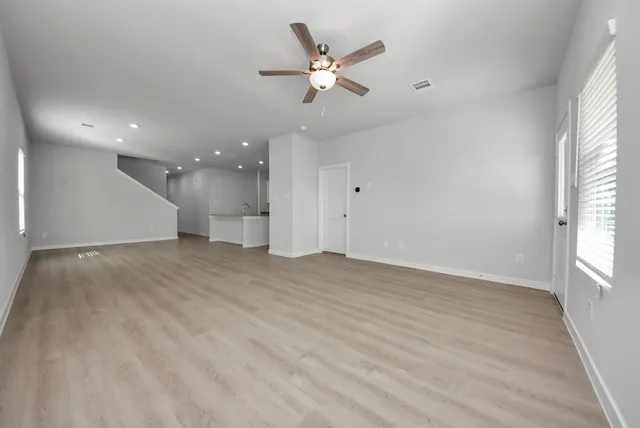 a view of an empty room with a window