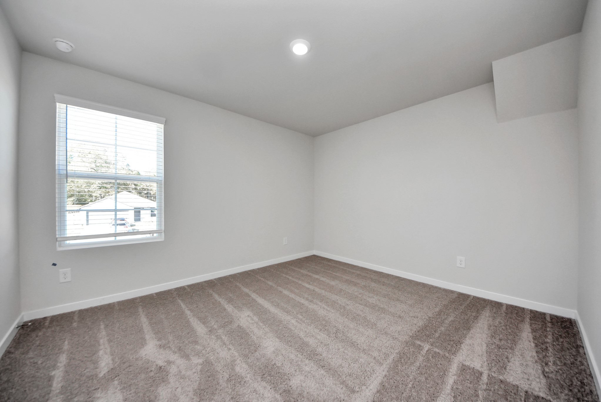 473 Shoreview Drive Conroe, TX 77303 - Photo 45 of 49 an empty room with a window