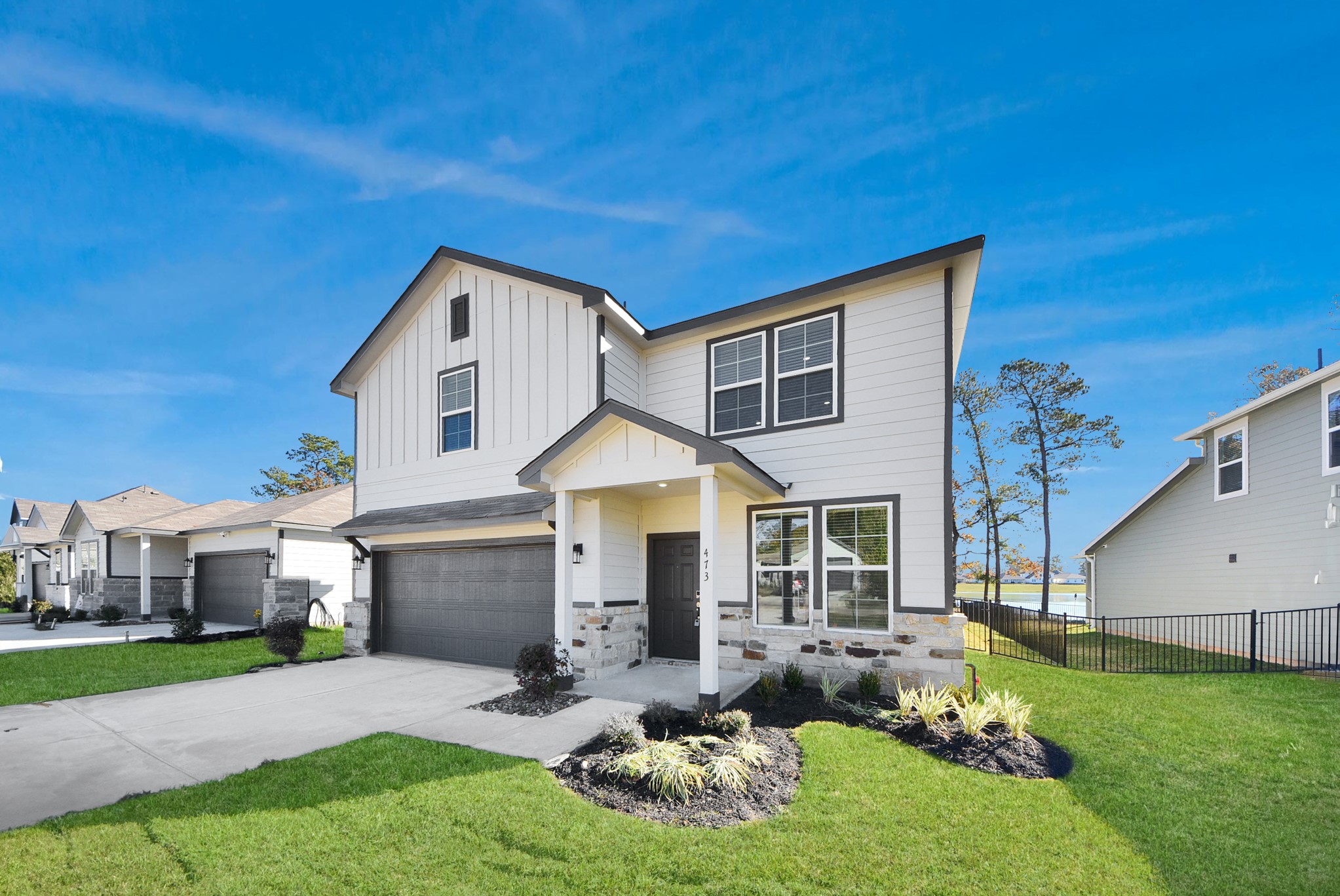 473 Shoreview Drive Conroe, TX 77303 - Photo 8 of 49 a front view of a house with a yard and porch