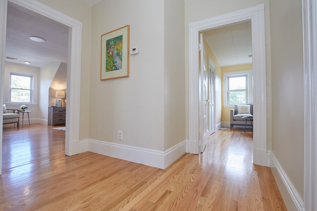 92 Coolidge Street, Unit 2 Brookline, MA 02446 - Photo 15 of 29 wooden floor in a livingroom and a bathroom