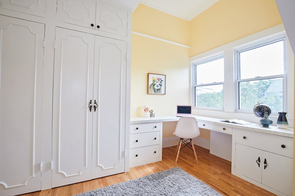92 Coolidge Street, Unit 2 Brookline, MA 02446 - Photo 18 of 29 a spacious bathroom with a double vanity sink a mirror and a bathtub