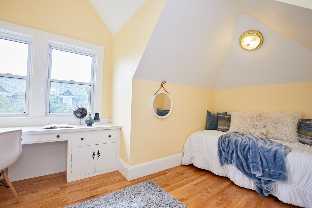92 Coolidge Street, Unit 2 Brookline, MA 02446 - Photo 20 of 29 a bedroom with a bed and window