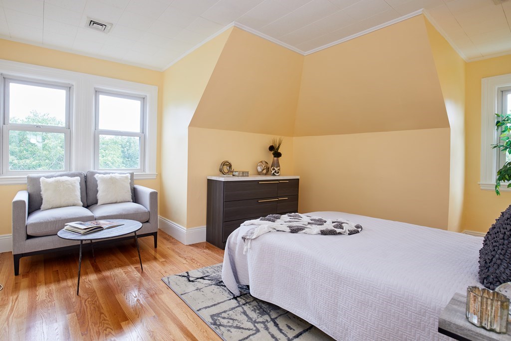 92 Coolidge Street, Unit 2 Brookline, MA 02446 - Photo 23 of 29 a bedroom with a bed and a couch