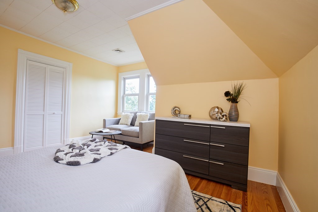 92 Coolidge Street, Unit 2 Brookline, MA 02446 - Photo 24 of 29 a bedroom with a bed and window