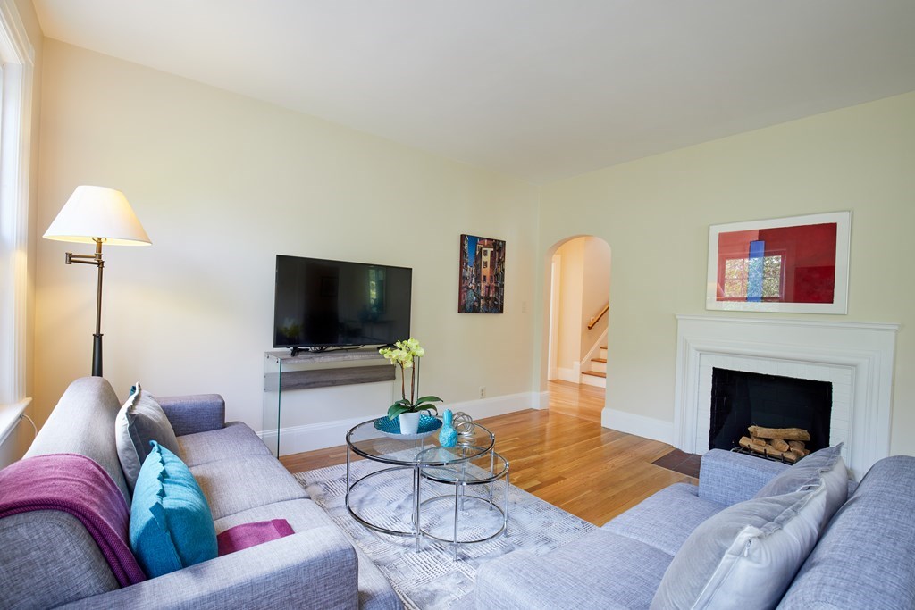 92 Coolidge Street, Unit 2 Brookline, MA 02446 - Photo 3 of 29 a living room with furniture and a flat screen tv