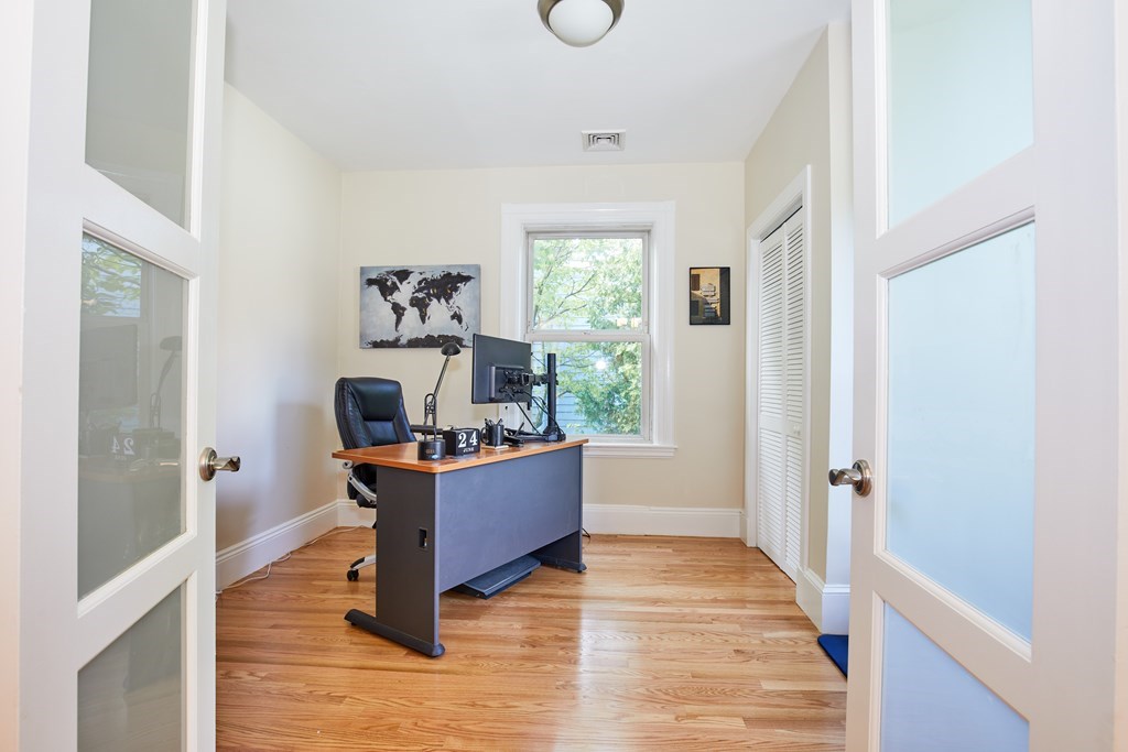 92 Coolidge Street, Unit 2 Brookline, MA 02446 - Photo 5 of 29 a living room with furniture and a table