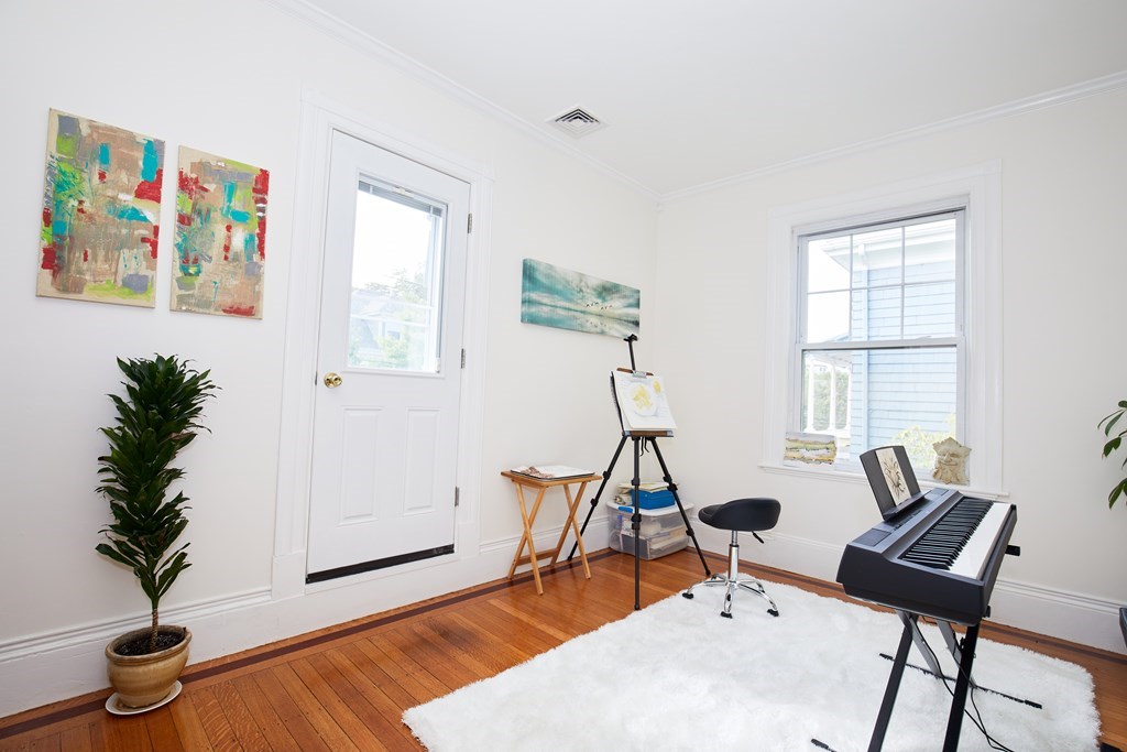 92 Coolidge Street, Unit 2 Brookline, MA 02446 - Photo 10 of 29 a view of a livingroom with furniture and a potted plant