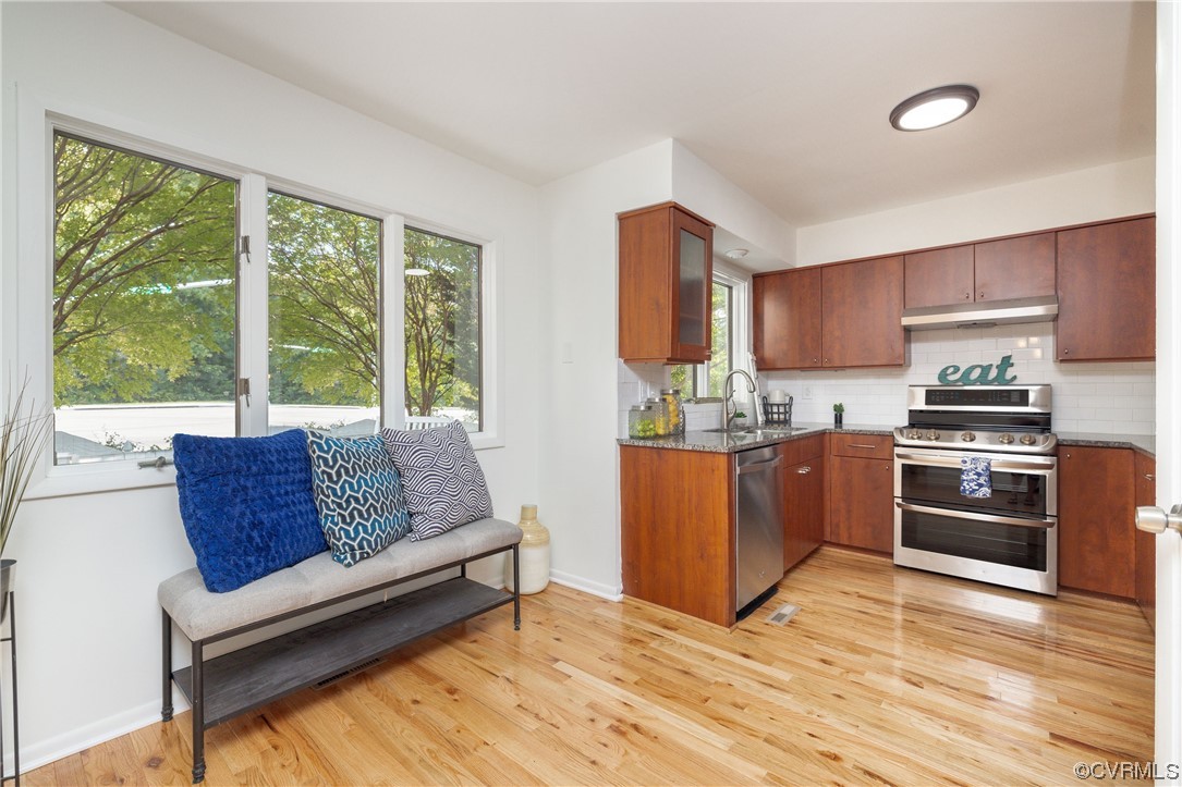 1701 Quail Covey Road Henrico, VA 23238 - Photo 13 of 45 a living room with stainless steel appliances furniture a large window and a kitchen view