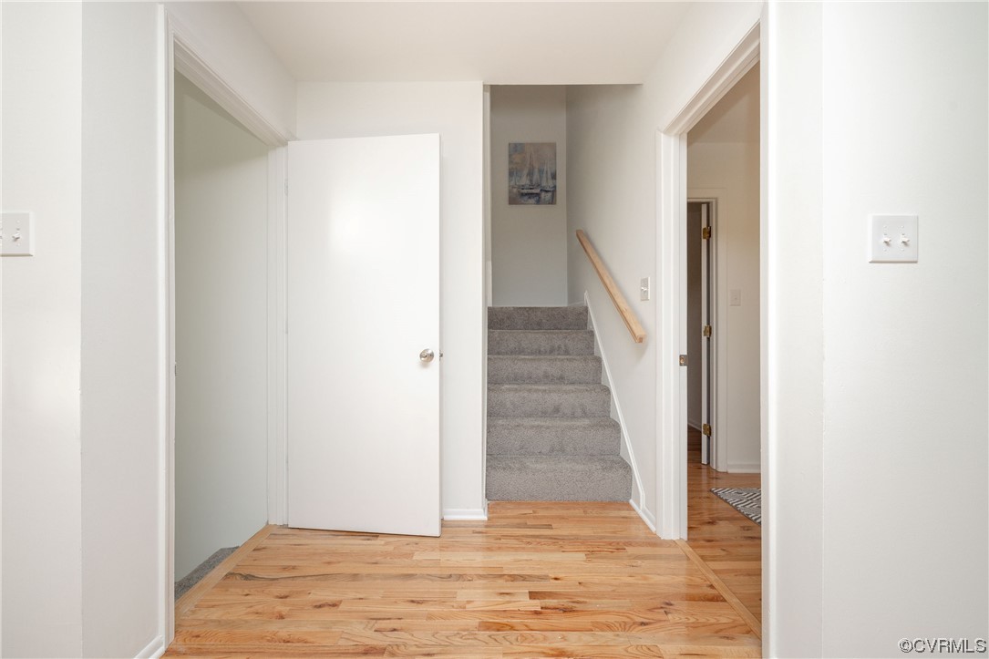 1701 Quail Covey Road Henrico, VA 23238 - Photo 21 of 45 a view of a hallway with wooden floor and staircase