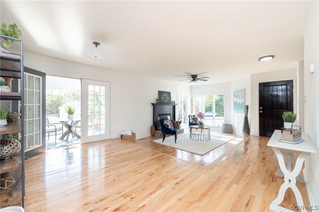 1701 Quail Covey Road Henrico, VA 23238 - Photo 4 of 45 a living room with furniture a wooden floor and a large window