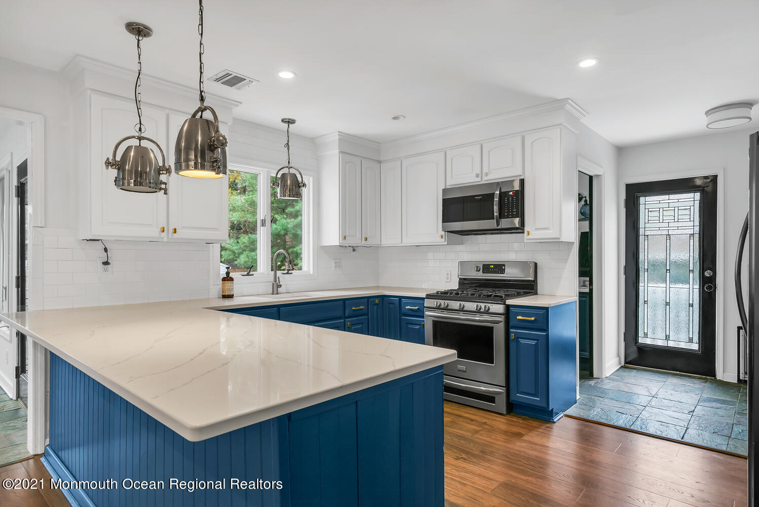 490 River Road Fair Haven, NJ 07704 - Photo 7 of 16 a kitchen with a stove a sink and a refrigerator