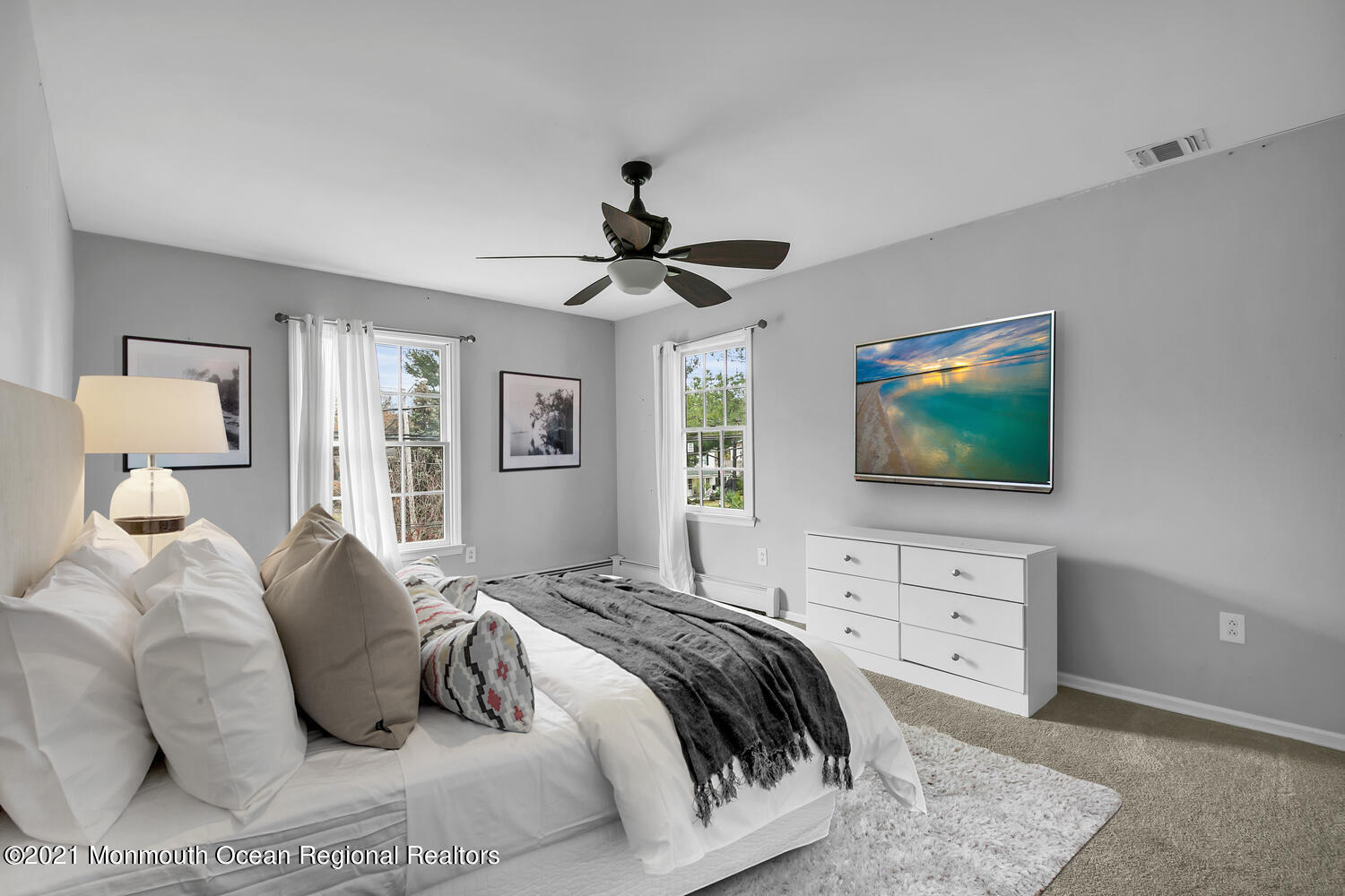 490 River Road Fair Haven, NJ 07704 - Photo 9 of 16 a bedroom with a large bed and a flat screen tv