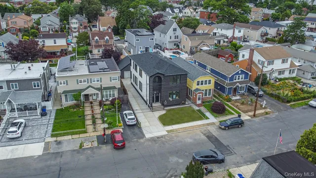 an aerial view of a house with a swimming pool