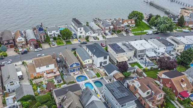 an aerial view of a city and lake view