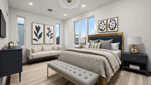 a bedroom with a bed and a couch