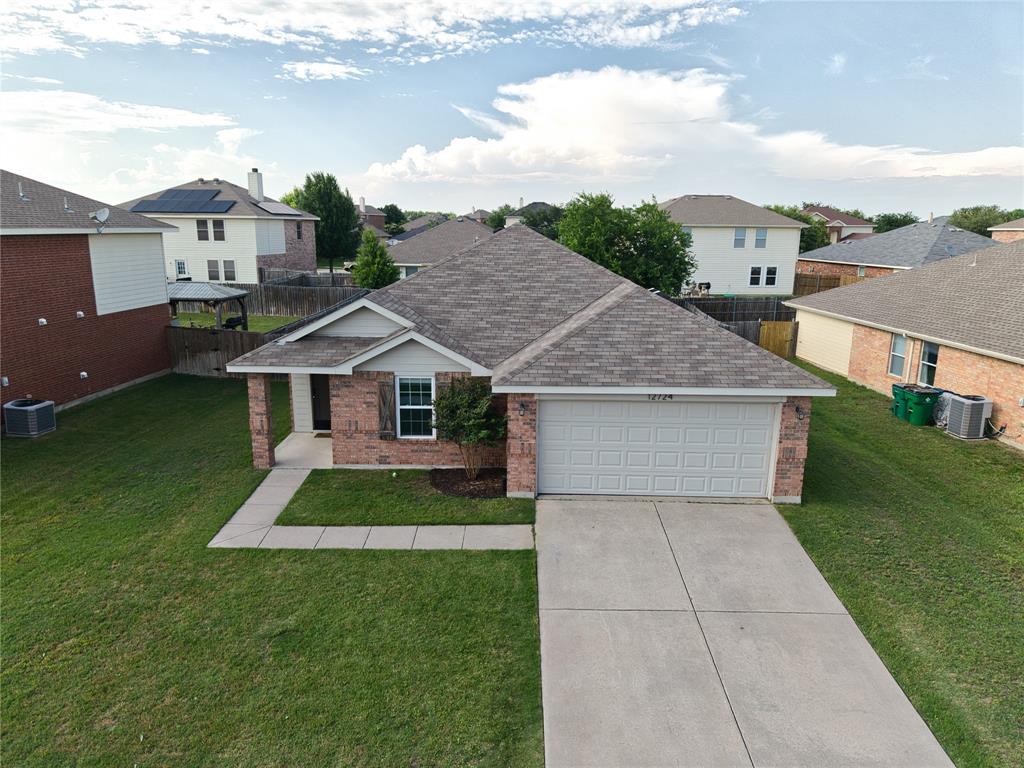 12724 Carpenter Lane Rhome, TX 76078 - Photo 30 of 37 Single-story residence featuring a brick and siding exterior, an attached garage, and a concrete driveway