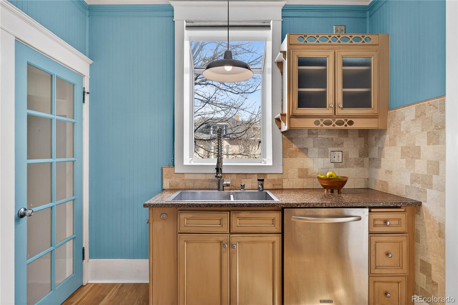 3056 York Street Denver, CO 80205 - Photo 14 of 44 a bathroom with a granite countertop sink and a window