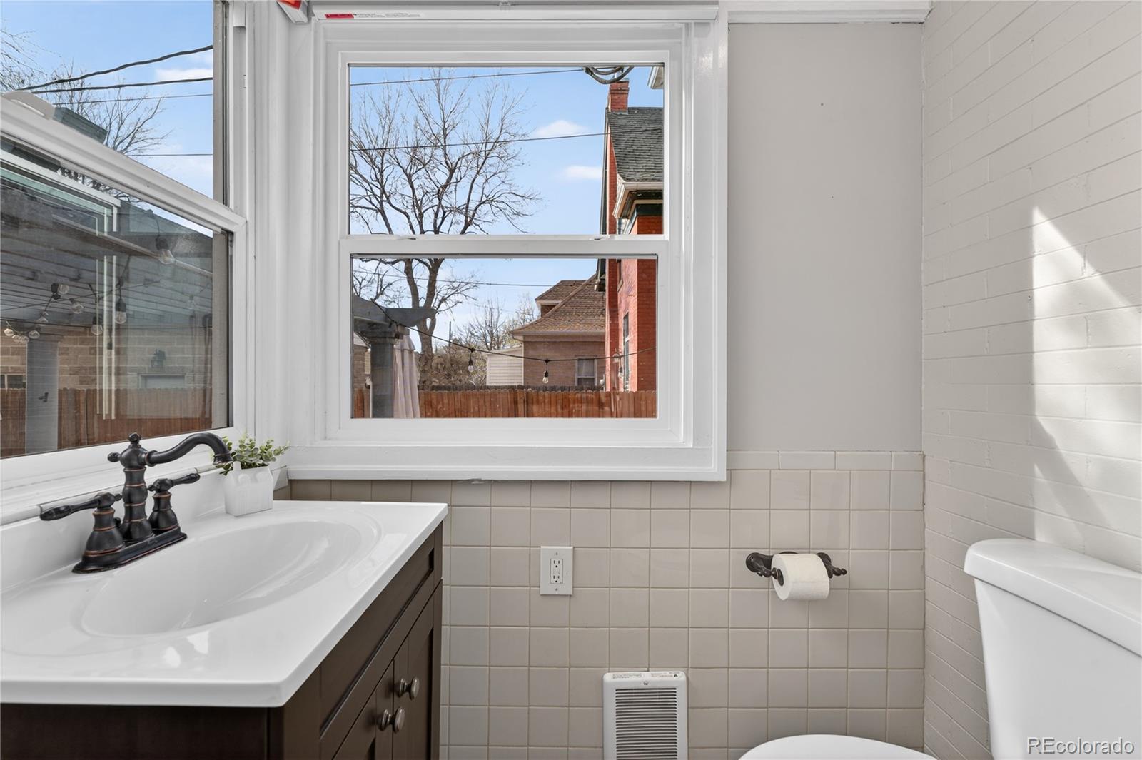 3056 York Street Denver, CO 80205 - Photo 16 of 44 a bathroom with a sink and a mirror