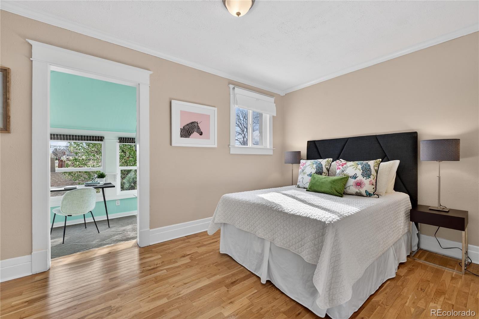 3056 York Street Denver, CO 80205 - Photo 18 of 44 a bedroom with a bed and a table