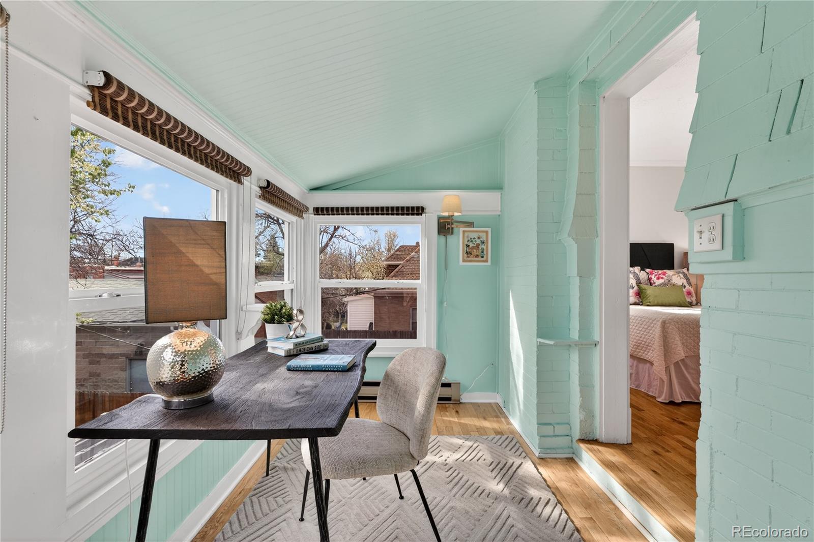 3056 York Street Denver, CO 80205 - Photo 20 of 44 a view of a dining room with furniture and a window