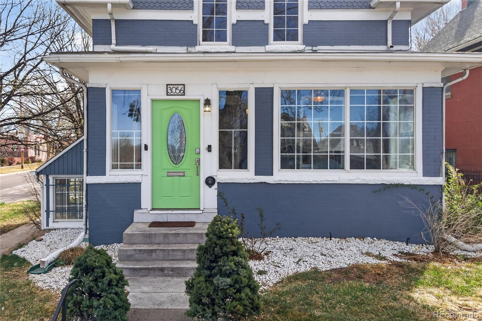 3056 York Street Denver, CO 80205 - Photo 2 of 44 a front view of a house with a garden