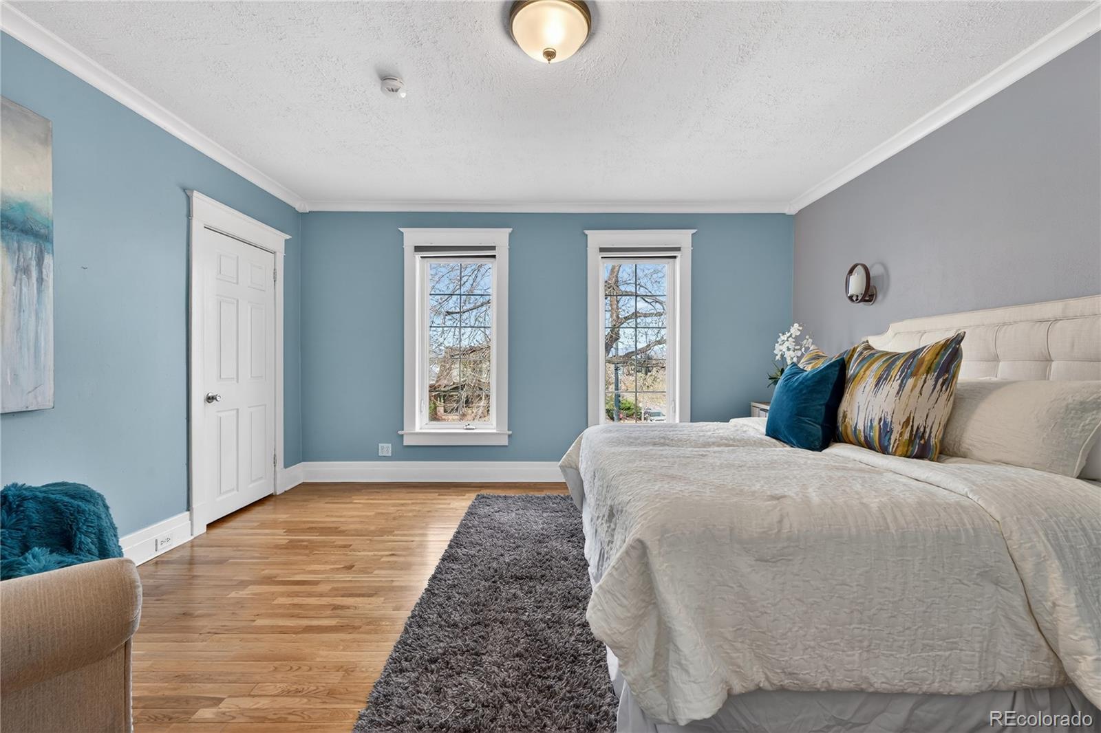 3056 York Street Denver, CO 80205 - Photo 24 of 44 a bedroom with a bed and window