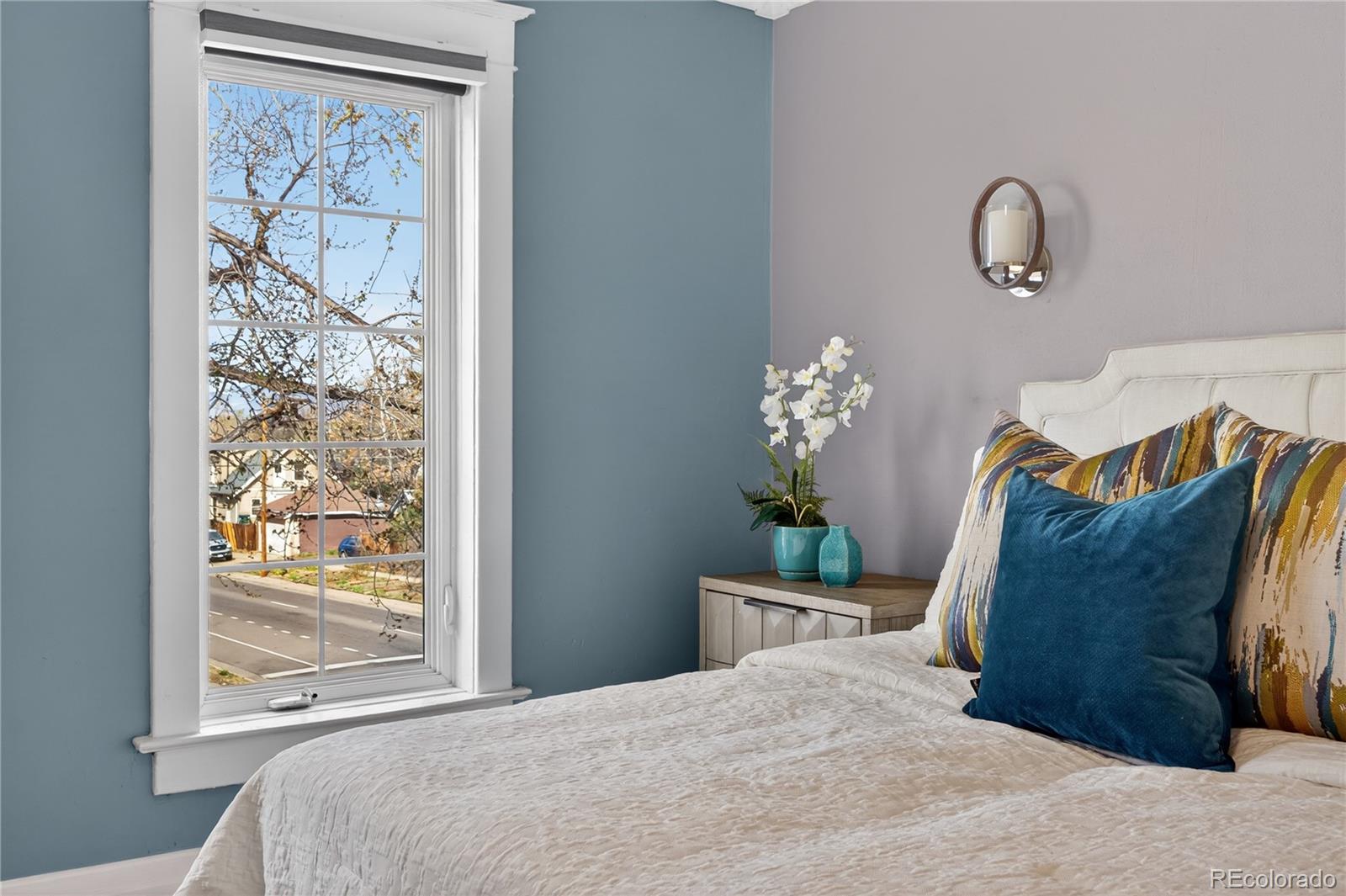 3056 York Street Denver, CO 80205 - Photo 26 of 44 a bedroom with a bed and a window
