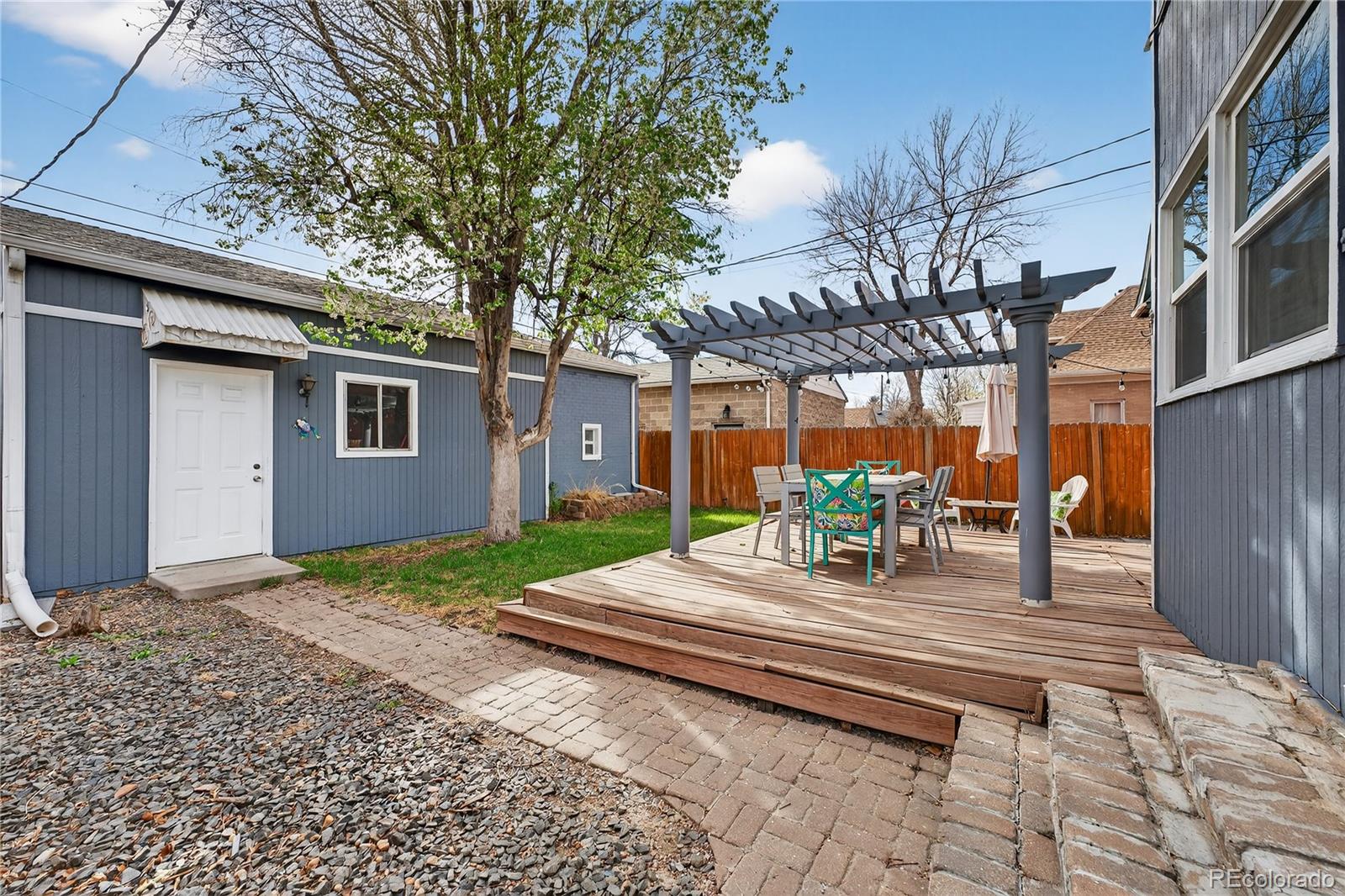 3056 York Street Denver, CO 80205 - Photo 34 of 44 a wooden bench sitting in front of a house