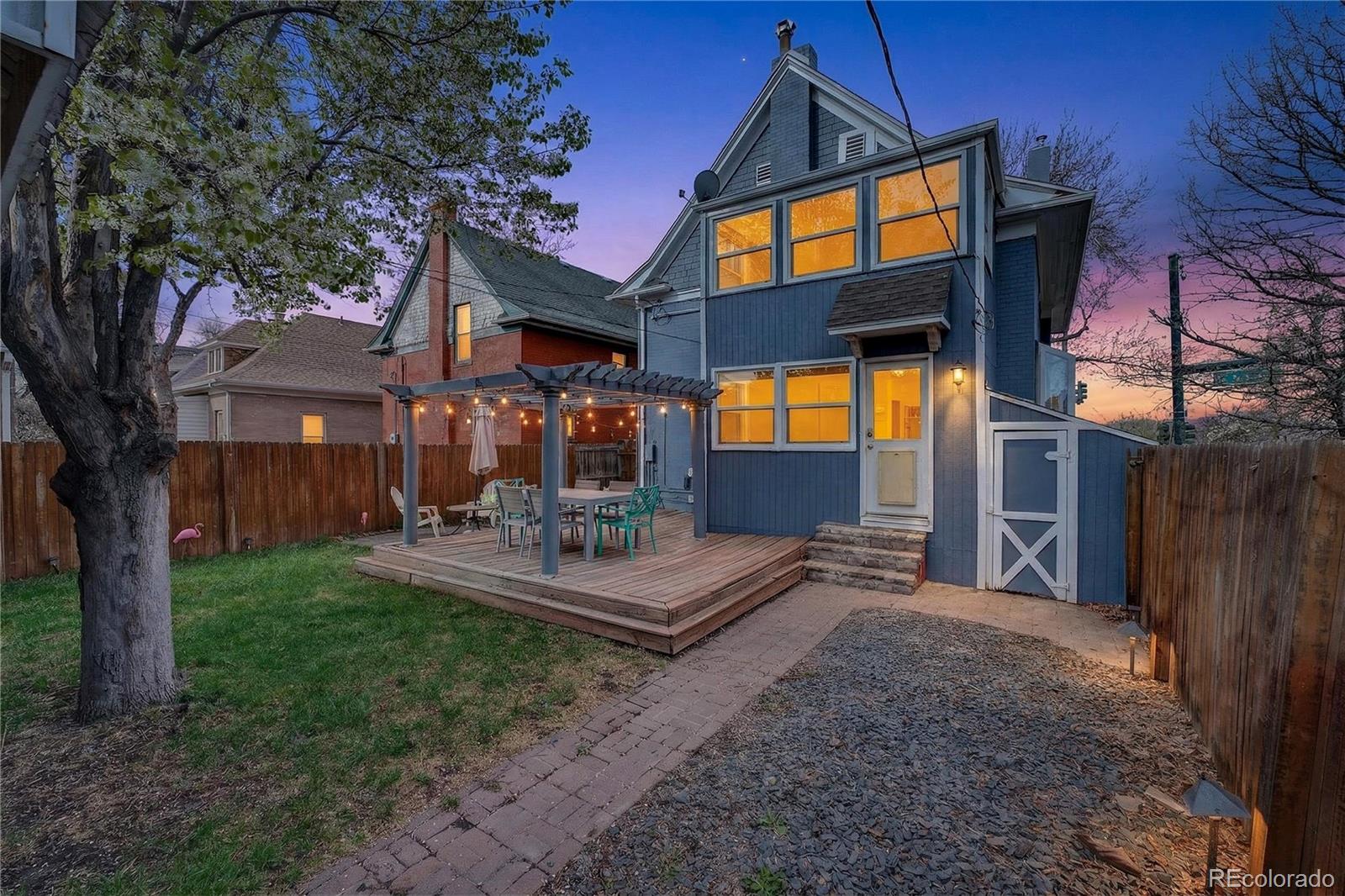 3056 York Street Denver, CO 80205 - Photo 35 of 44 a view of a house with backyard and trees
