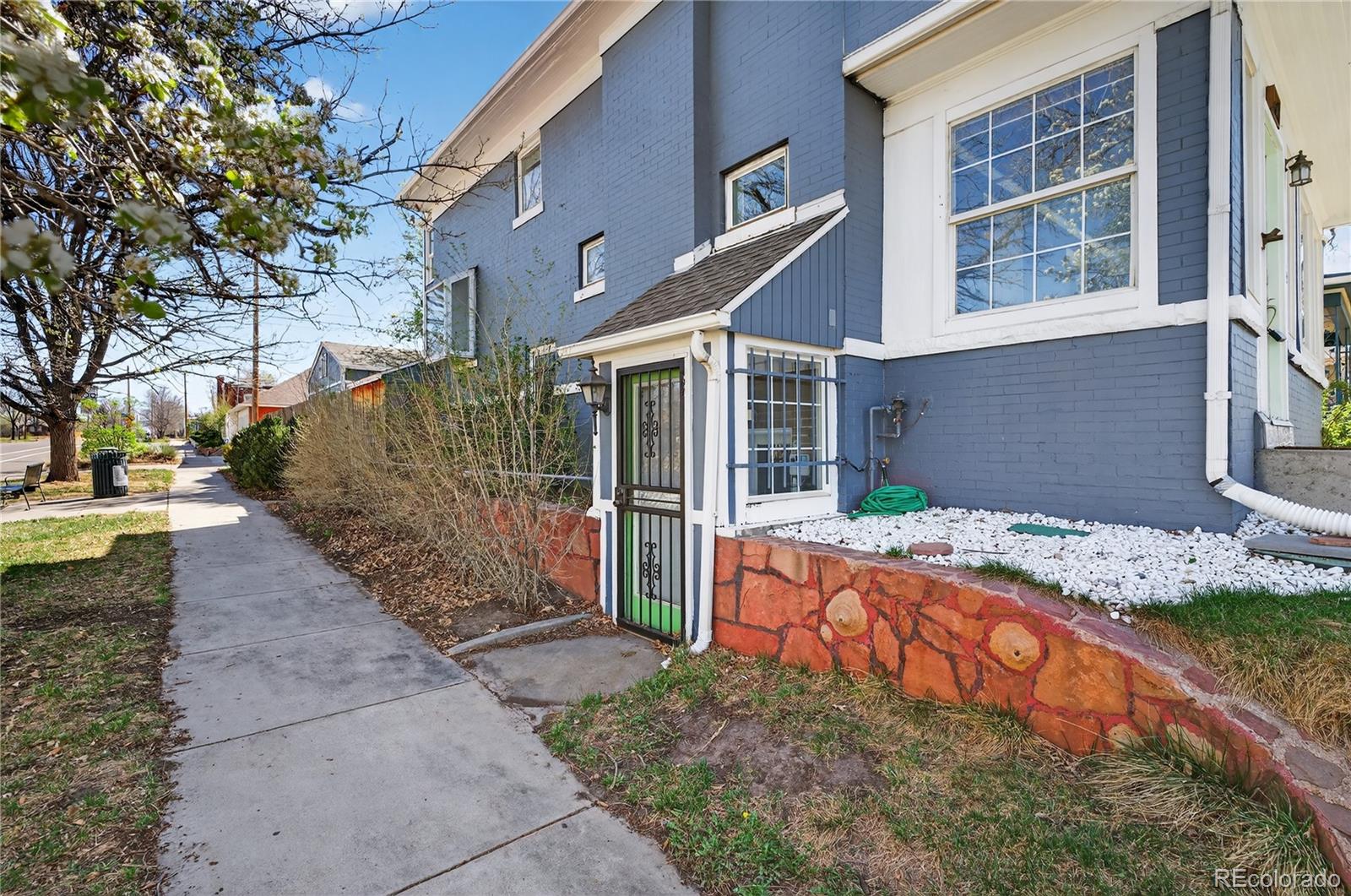 3056 York Street Denver, CO 80205 - Photo 38 of 44 a view of brick house with large windows